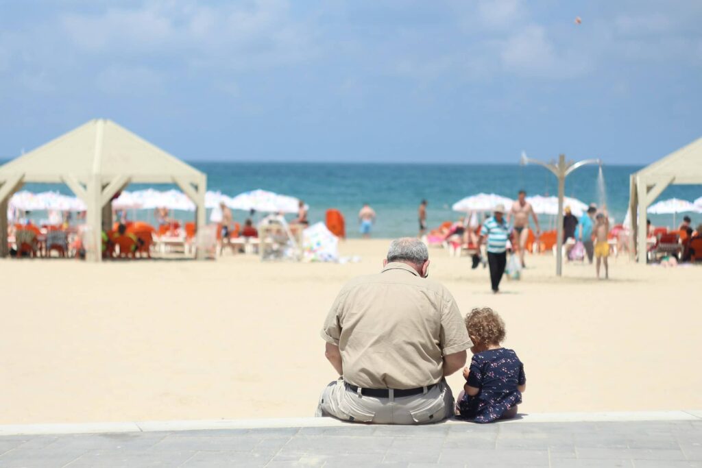 Man sitting besides girl on bench